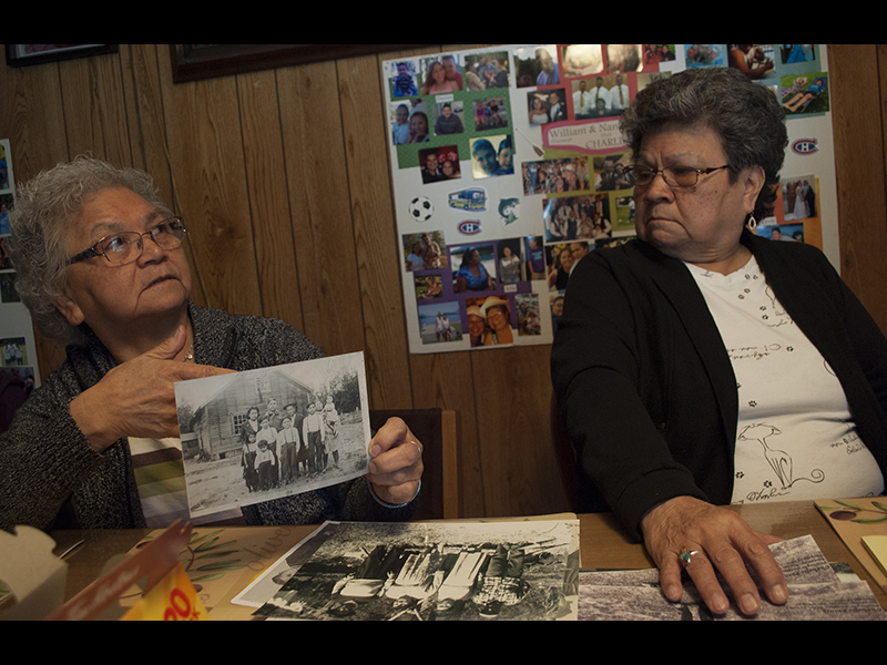 Sisters Ginni Peters (left) and Pat Charlie in Pat’s home in Sts’ailes. The sisters have played a prominent role in reviving spiritual customs in the community. Photo by Sophie Woodrooffe.